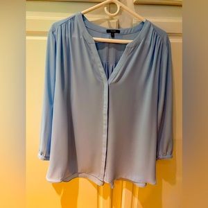 Light blue v necked blouse